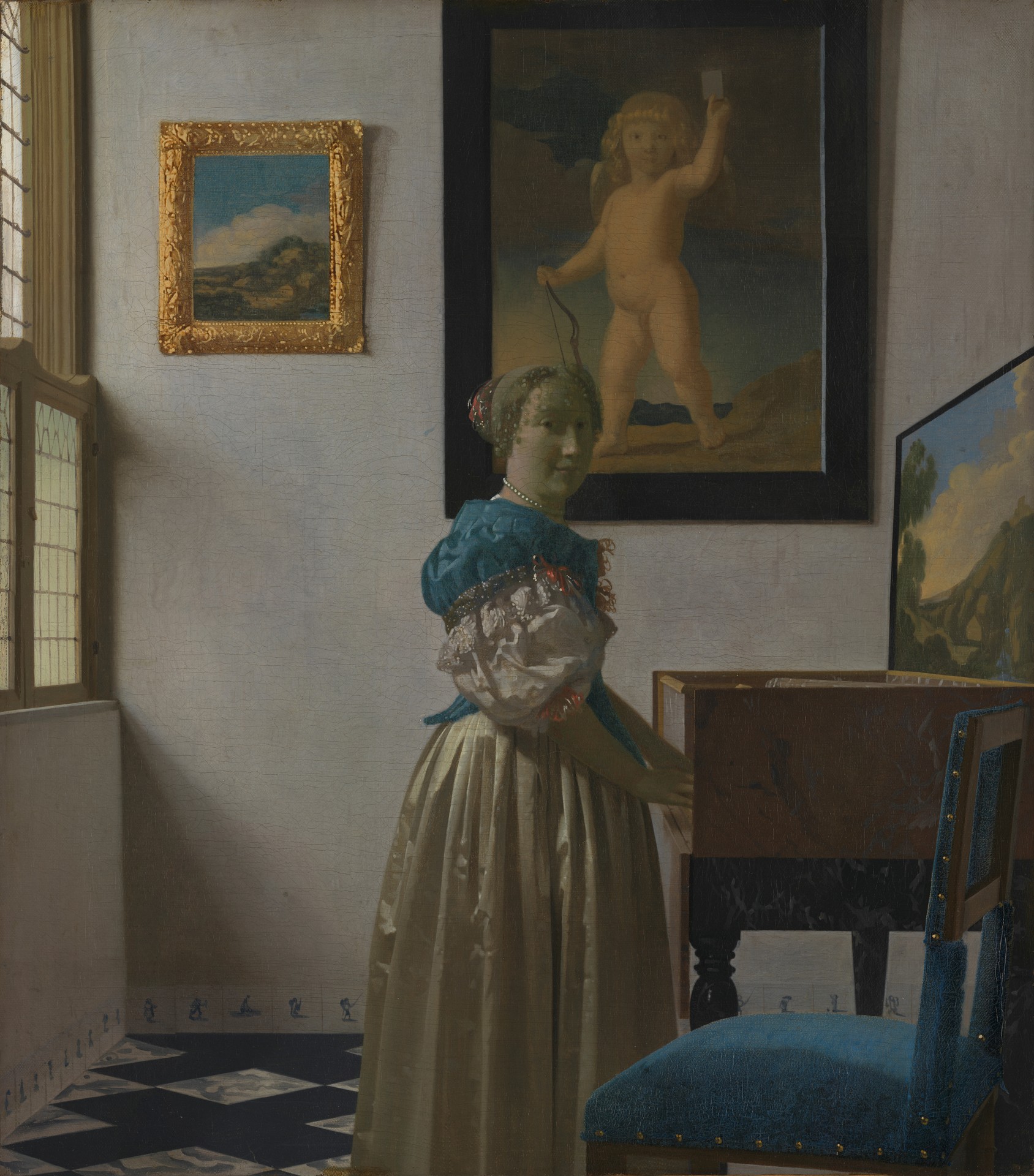 A Young Woman Standing at a Virginal - by Johannes Vermeer